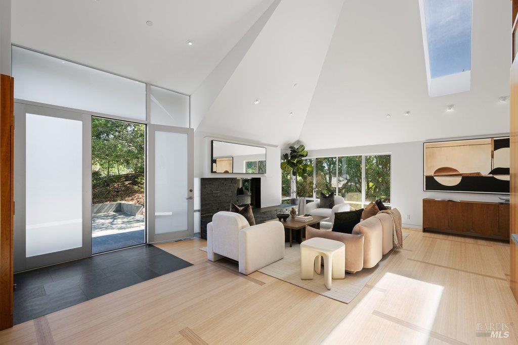 103 Reed Ranch Road Tiburon, CA 94920 - Photo 12 of 89 a living room with furniture and a fireplace