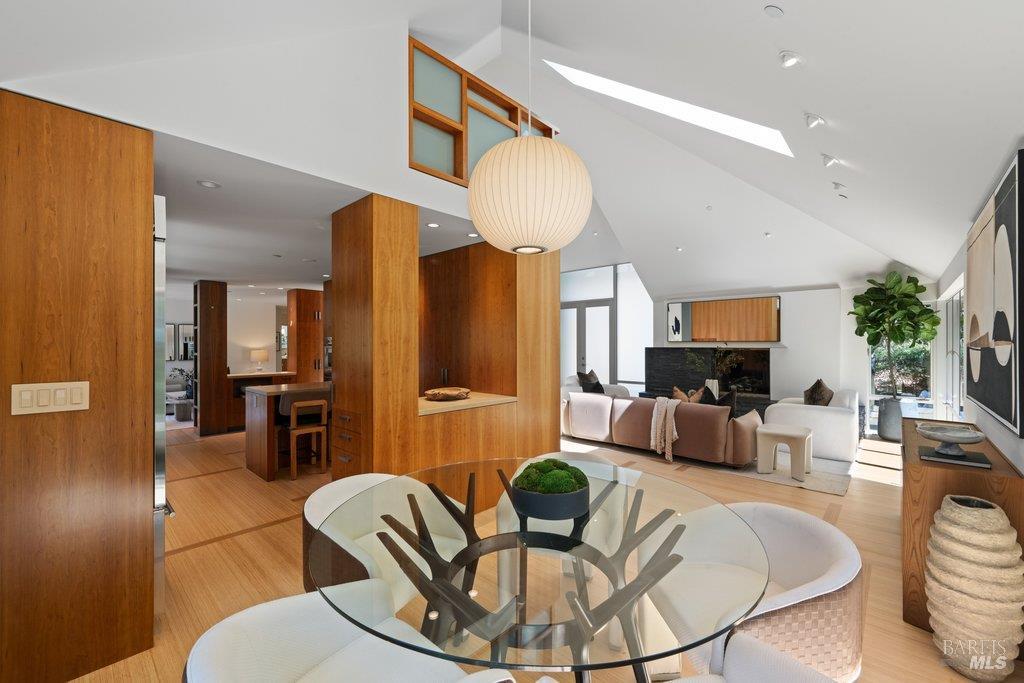 103 Reed Ranch Road Tiburon, CA 94920 - Photo 13 of 89 a living room with furniture a dining table and a chandelier