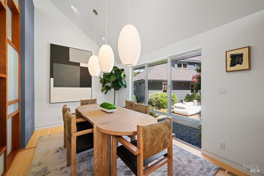 103 Reed Ranch Road Tiburon, CA 94920 - Photo 23 of 89 a dining room with a table and chairs