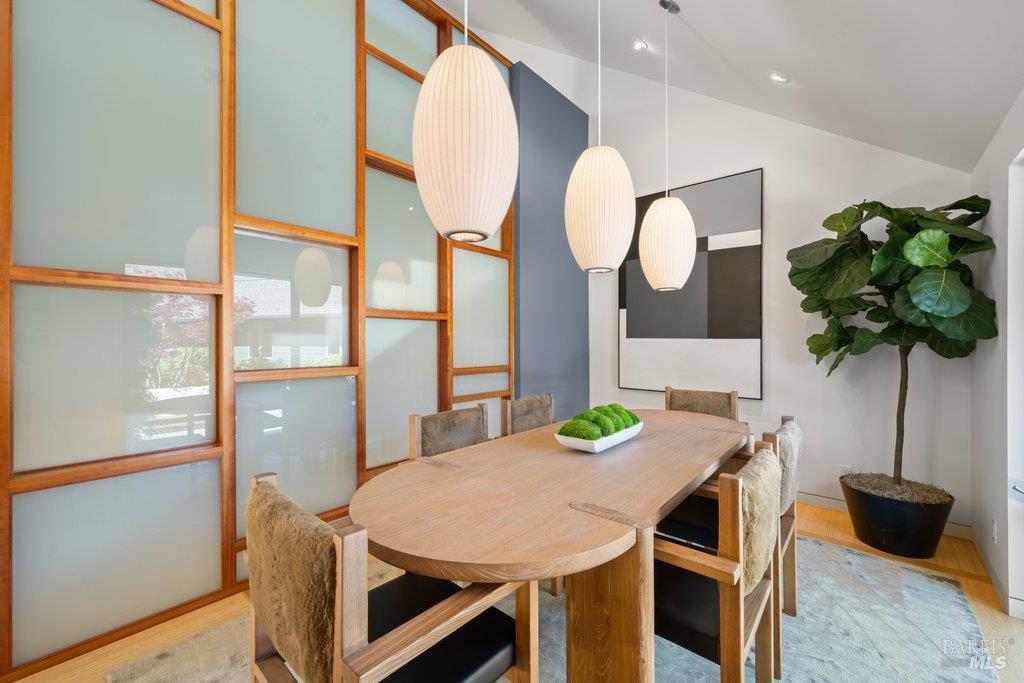 103 Reed Ranch Road Tiburon, CA 94920 - Photo 24 of 89 a view of a dining room with furniture and a potted plant