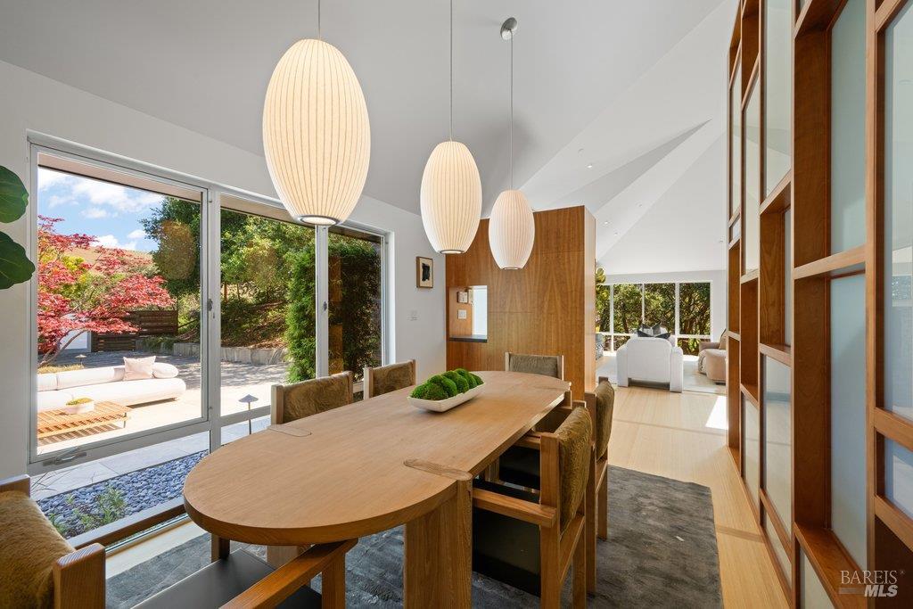 103 Reed Ranch Road Tiburon, CA 94920 - Photo 25 of 89 a view of a dining room with furniture wooden floor and a large window