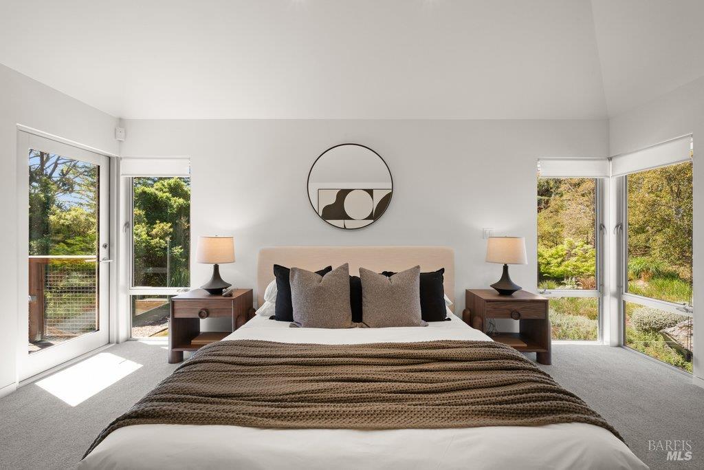 103 Reed Ranch Road Tiburon, CA 94920 - Photo 33 of 89 a bedroom with a bed and a large window with balcony view
