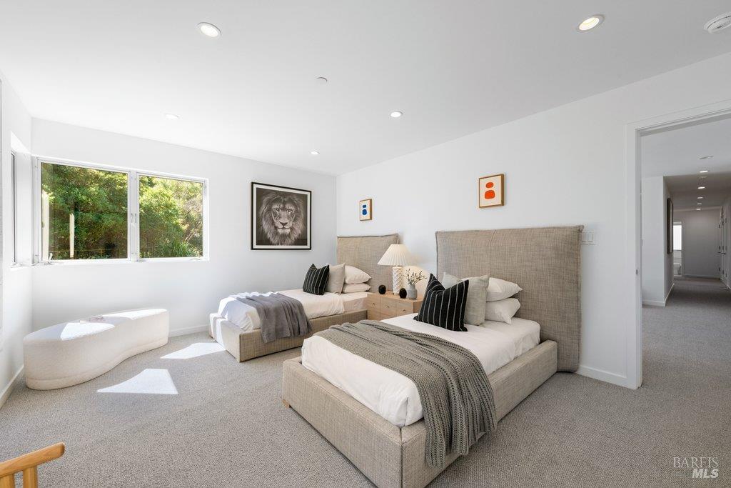 103 Reed Ranch Road Tiburon, CA 94920 - Photo 46 of 89 a bedroom with two beds and a large window