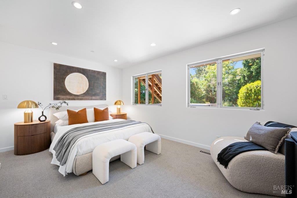 103 Reed Ranch Road Tiburon, CA 94920 - Photo 49 of 89 a bedroom with bed and a large window