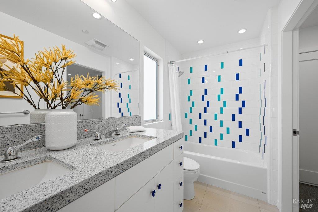 103 Reed Ranch Road Tiburon, CA 94920 - Photo 51 of 89 a bathroom with a granite countertop sink a toilet and shower