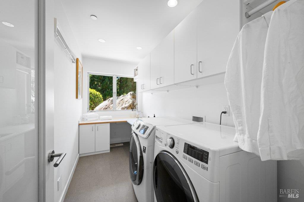 103 Reed Ranch Road Tiburon, CA 94920 - Photo 52 of 89 Full laundry room with sink, storage, and new flooring downstairs.