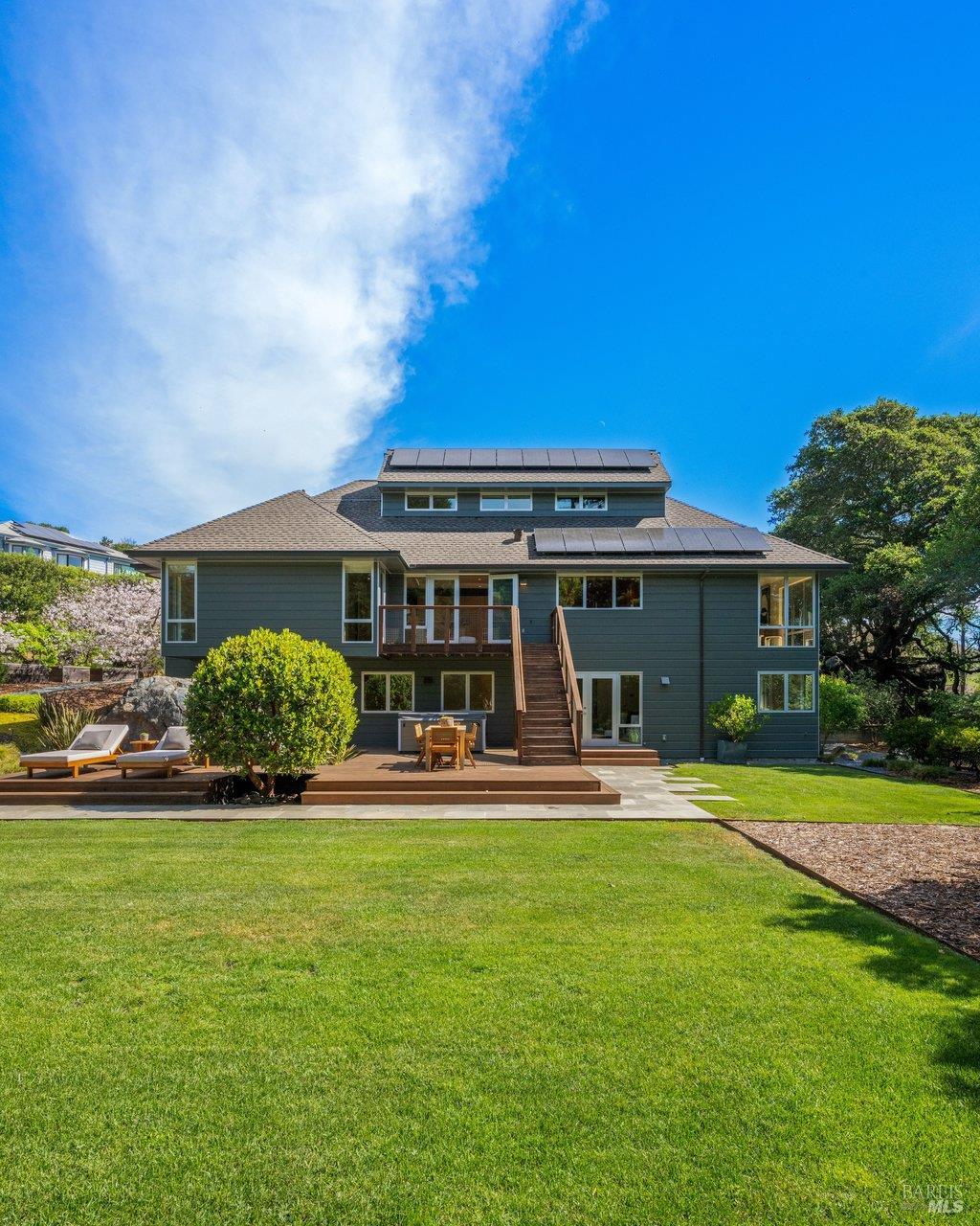 103 Reed Ranch Road Tiburon, CA 94920 - Photo 65 of 89 a front view of a house with a yard table and chairs