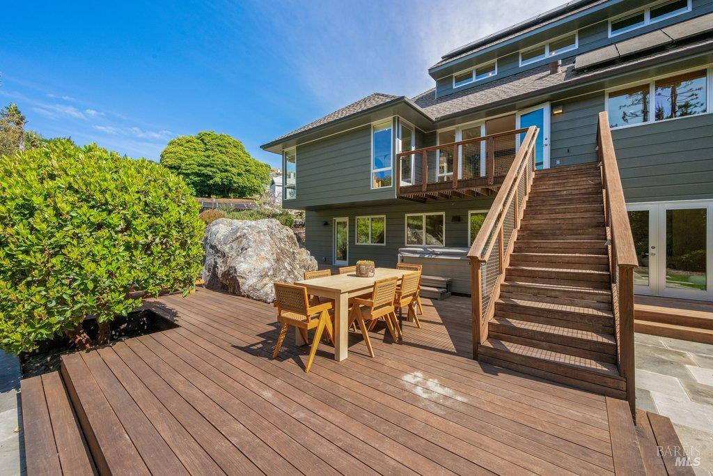 103 Reed Ranch Road Tiburon, CA 94920 - Photo 73 of 89 a view of a house with backyard sitting area and wooden floor