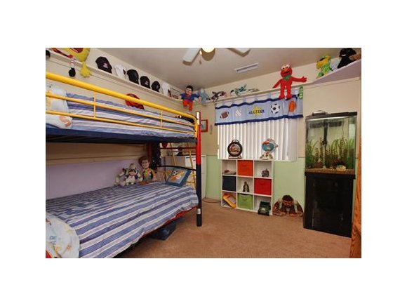 4336 North Sauter Drive East Prescott Valley, AZ 86314 - Photo 13 of 19 a bedroom with a bed and a mirror