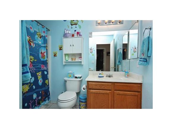 4336 North Sauter Drive East Prescott Valley, AZ 86314 - Photo 14 of 19 a bathroom with a sink a toilet and a mirror