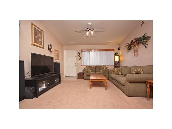 4336 North Sauter Drive East Prescott Valley, AZ 86314 - Photo 3 of 19 a living room with furniture and a flat screen tv