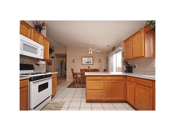 4336 North Sauter Drive East Prescott Valley, AZ 86314 - Photo 5 of 19 a kitchen with stainless steel appliances granite countertop a sink stove and cabinets