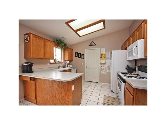 4336 North Sauter Drive East Prescott Valley, AZ 86314 - Photo 6 of 19 a kitchen with stainless steel appliances granite countertop a sink stove and refrigerator