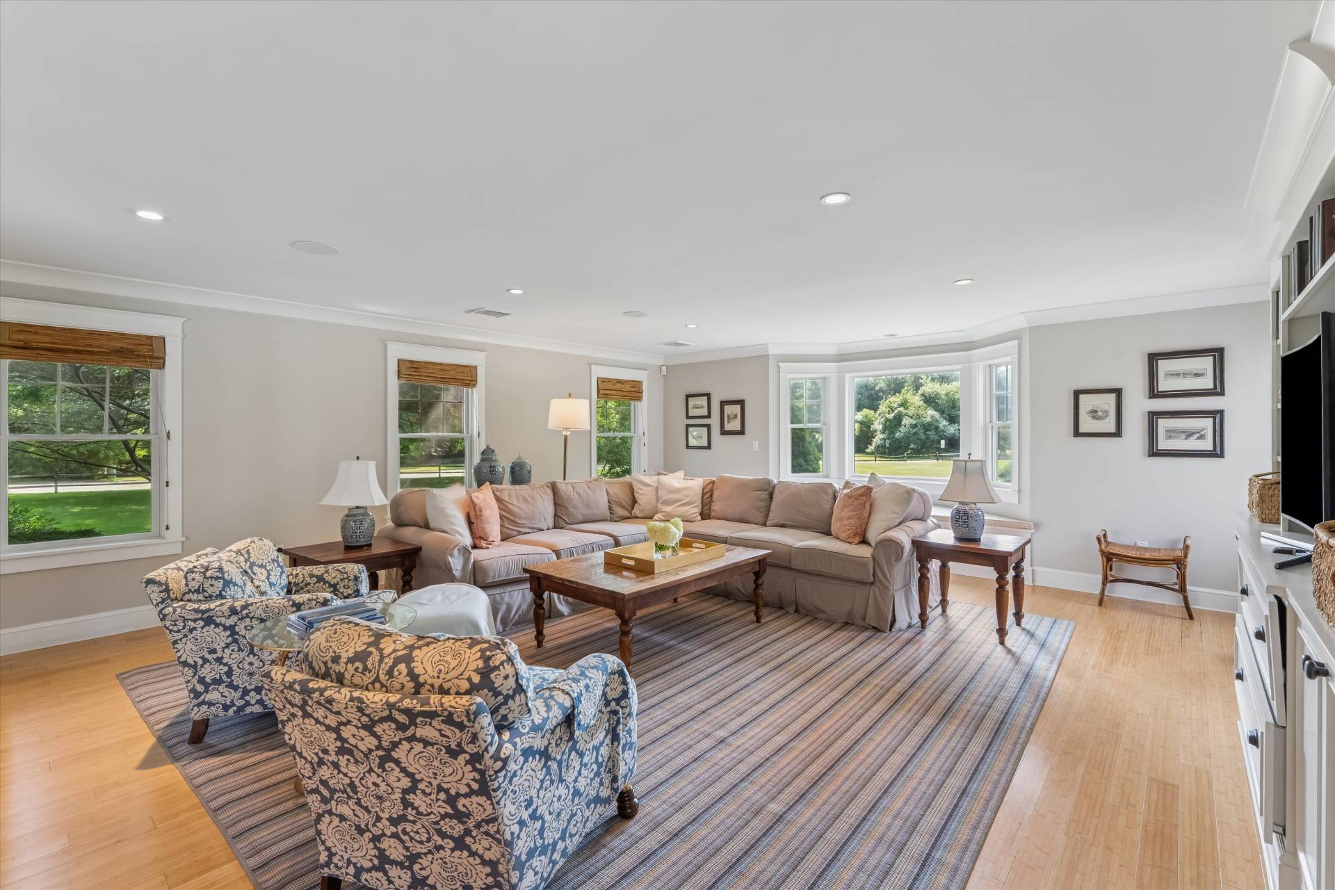 29 Bridle Path Remsenburg, NY 11960 - Photo 18 of 33 a living room with furniture and a wooden floor