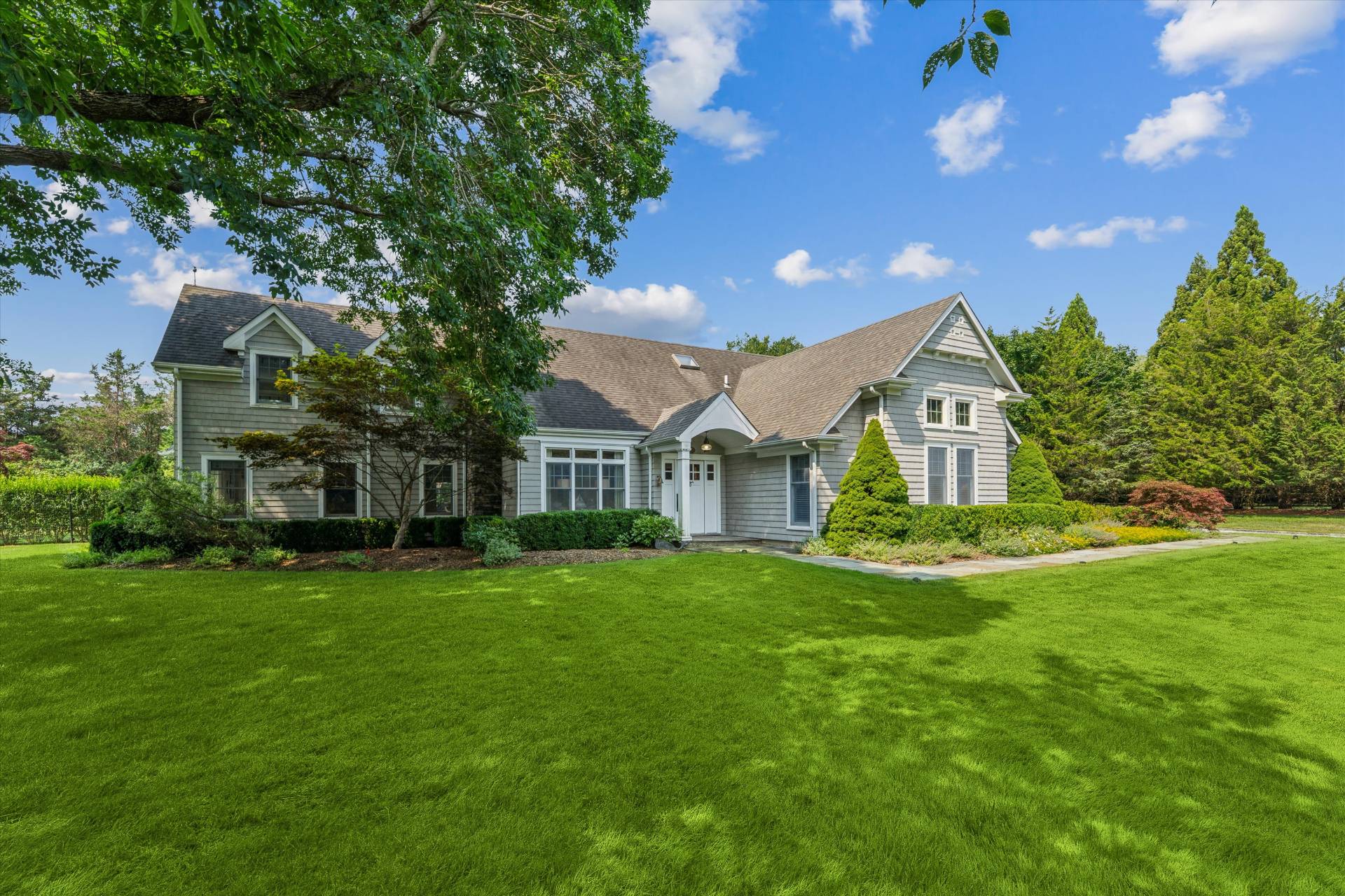 29 Bridle Path Remsenburg, NY 11960 - Photo 2 of 33 a view of a house with a big yard and large trees