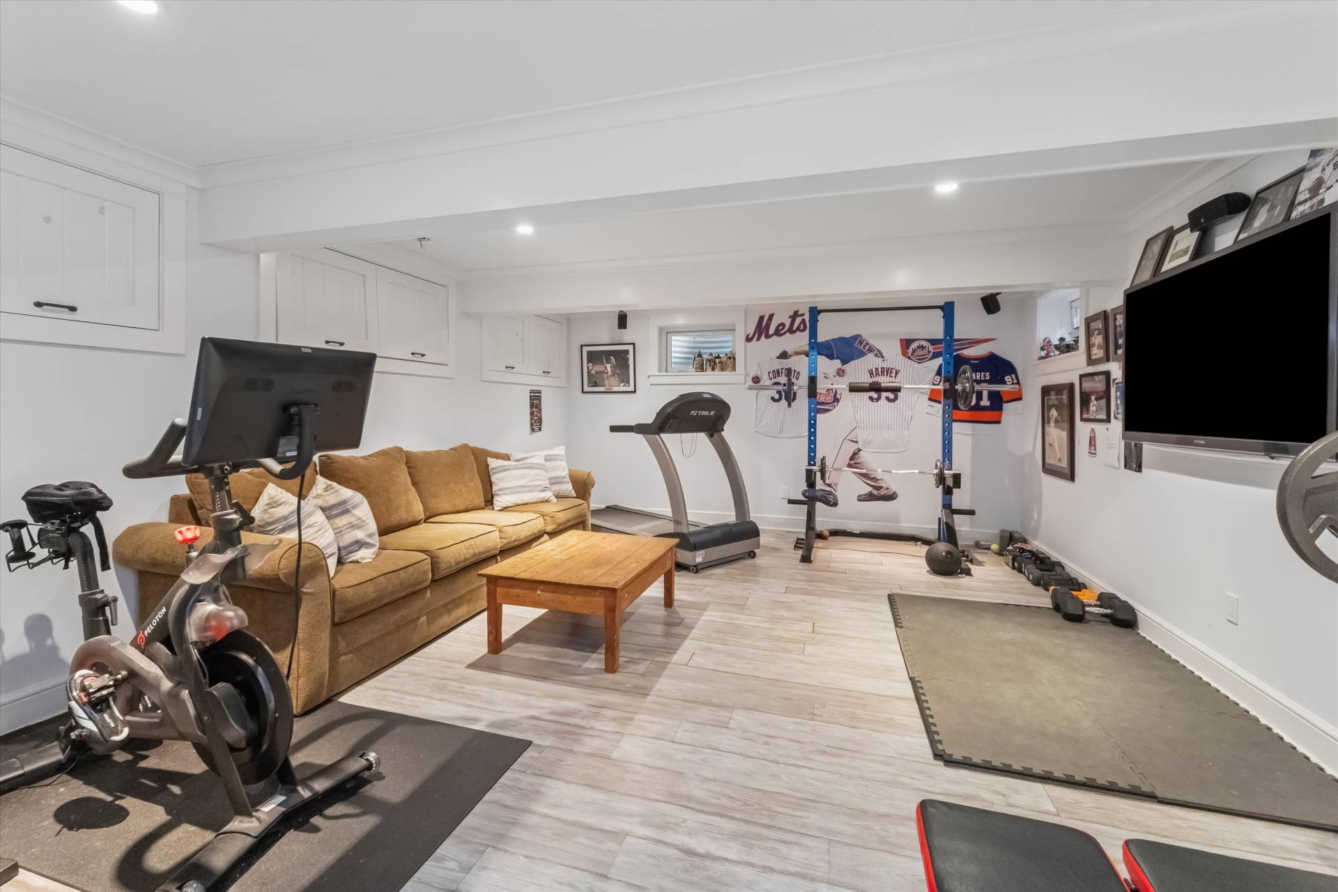 29 Bridle Path Remsenburg, NY 11960 - Photo 24 of 33 a living room with furniture and a flat screen tv
