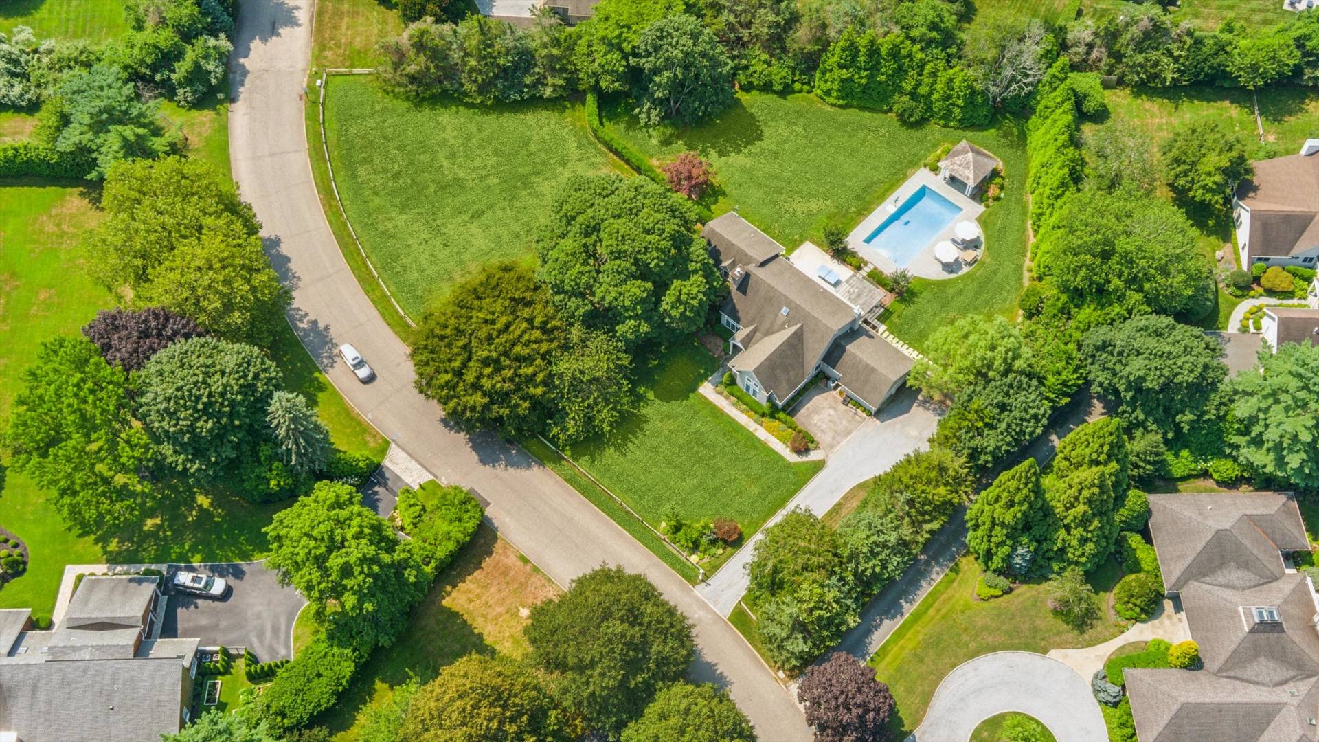 29 Bridle Path Remsenburg, NY 11960 - Photo 28 of 33 an aerial view of a house with a garden and lake view