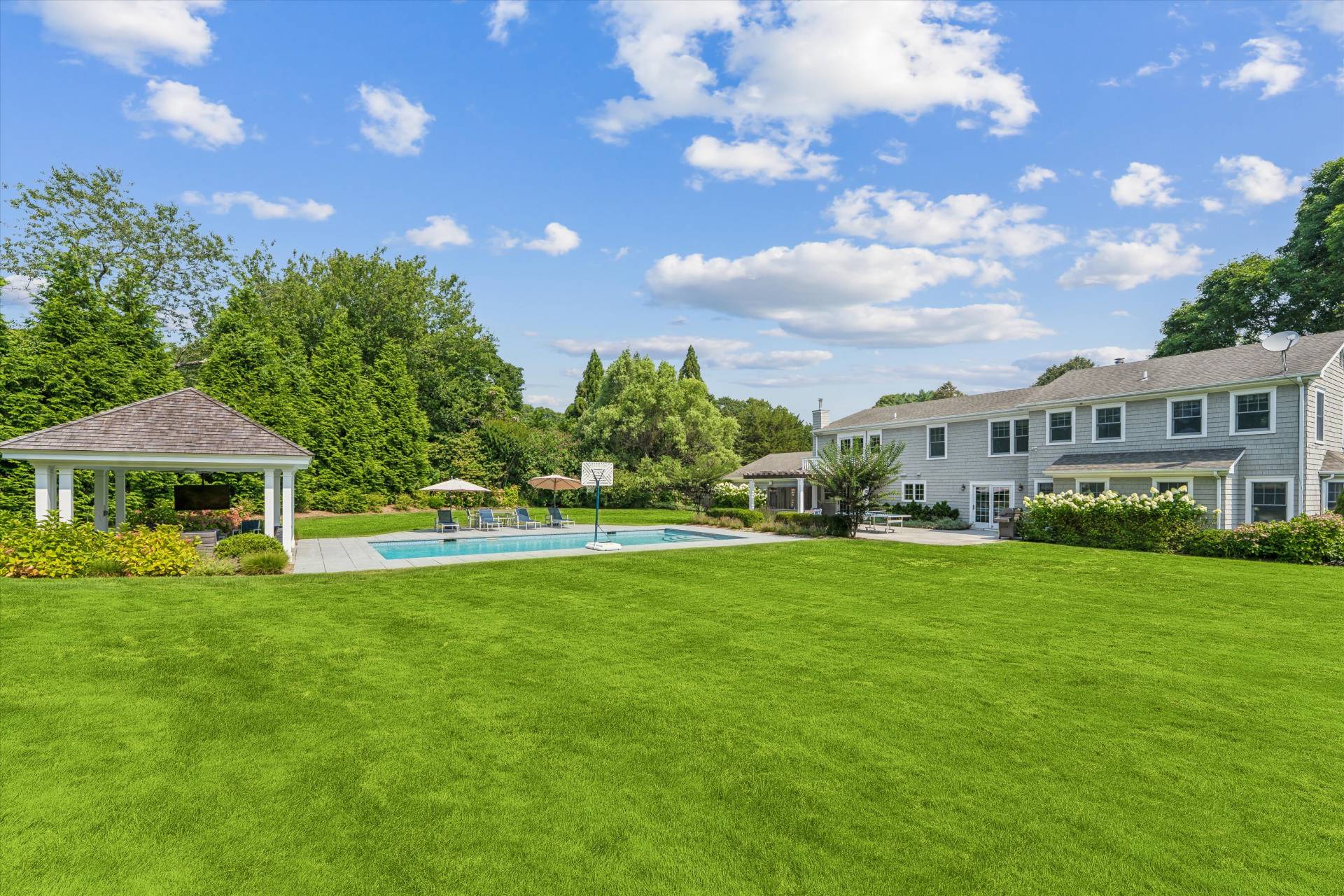 29 Bridle Path Remsenburg, NY 11960 - Photo 3 of 33 a view of a big yard with a house in the background