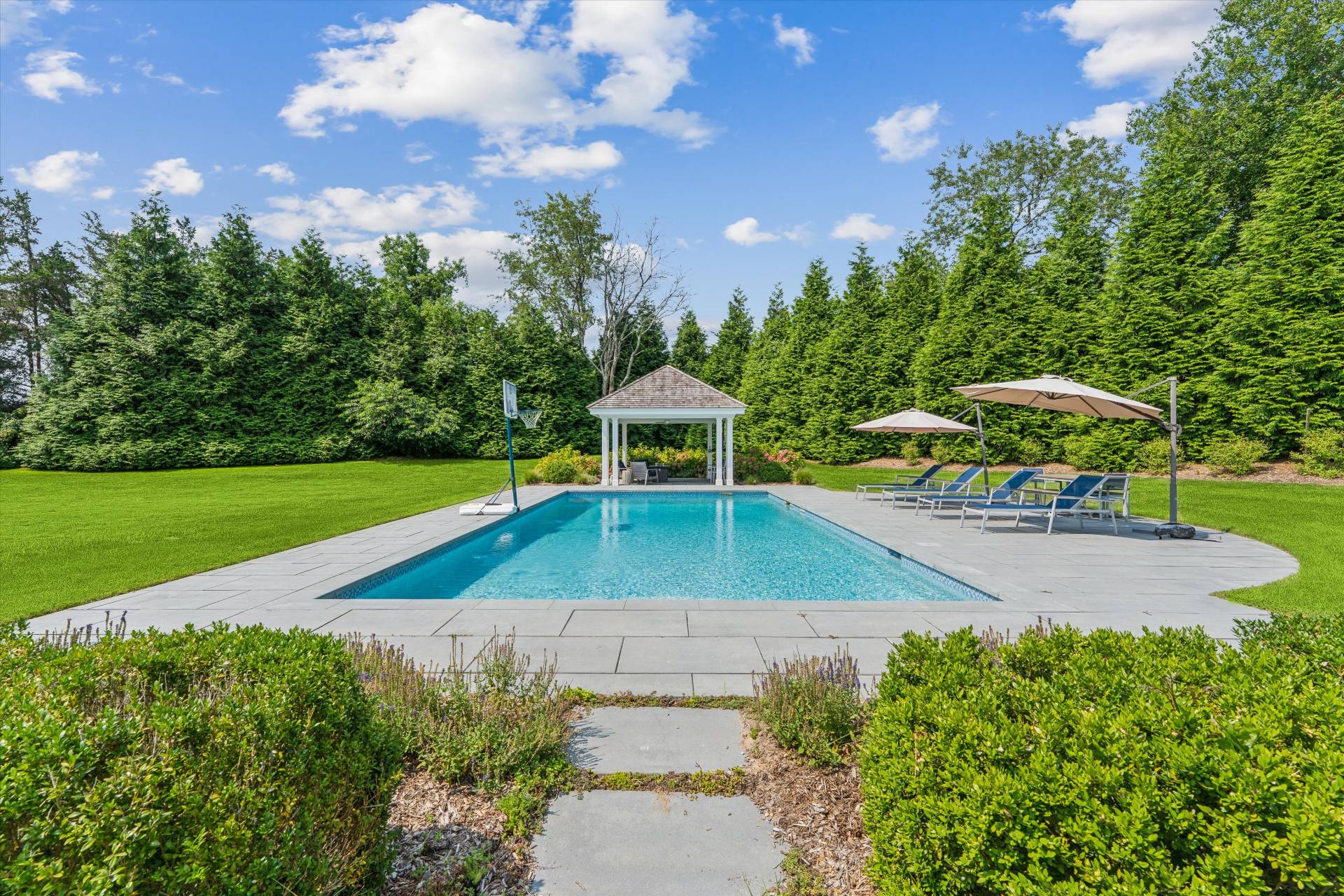 29 Bridle Path Remsenburg, NY 11960 - Photo 5 of 33 a view of a backyard with swimming pool
