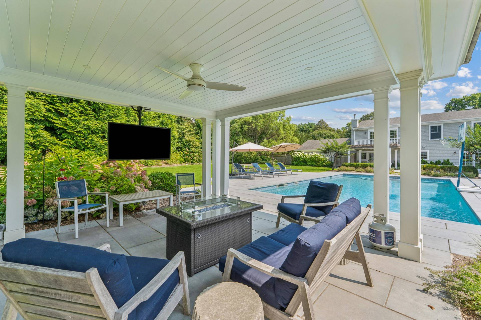 29 Bridle Path Remsenburg, NY 11960 - Photo 7 of 33 a outdoor space with furniture