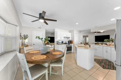 a kitchen with cabinets and stainless steel appliances