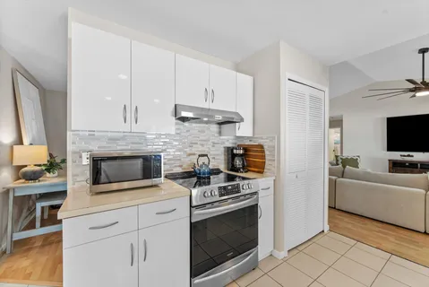 a kitchen with a sink and cabinets