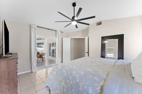 a bathroom with a granite countertop sink mirror and shower