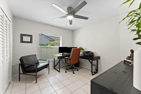 a view of a livingroom with workspace and a couch