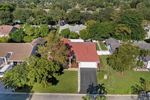 an aerial view of a house with a garden
