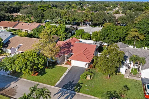 an aerial view of a house with a garden