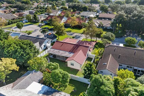 an aerial view of a house with a garden