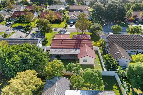 an aerial view of houses and yard