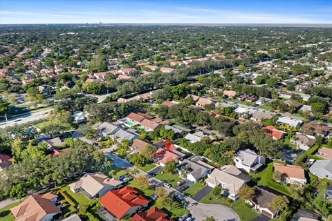 an aerial view of residential houses with outdoor space