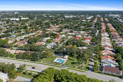 an aerial view of a house with a garden