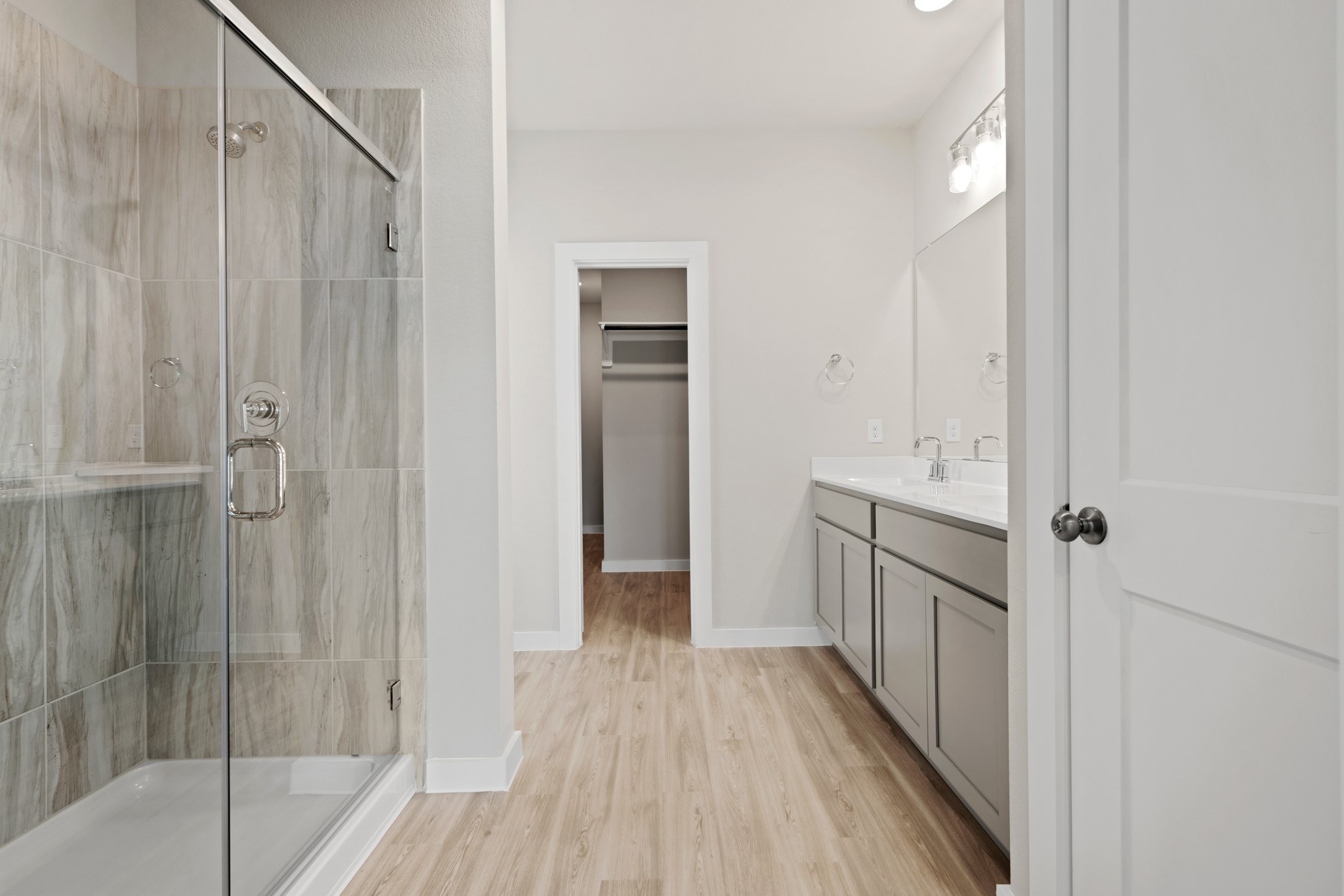 21667 Wave Holw Drive Cypress, TX 77433 - Photo 12 of 27 a view of a hallway with wooden floor and staircase