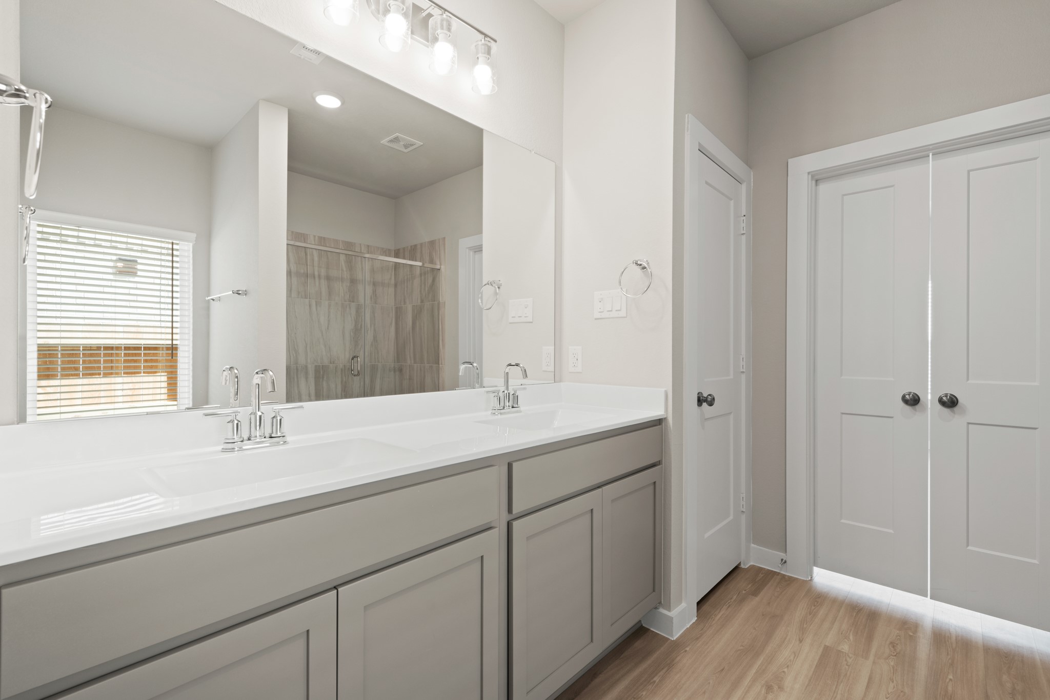 21667 Wave Holw Drive Cypress, TX 77433 - Photo 13 of 27 a bathroom with a sink and a mirror