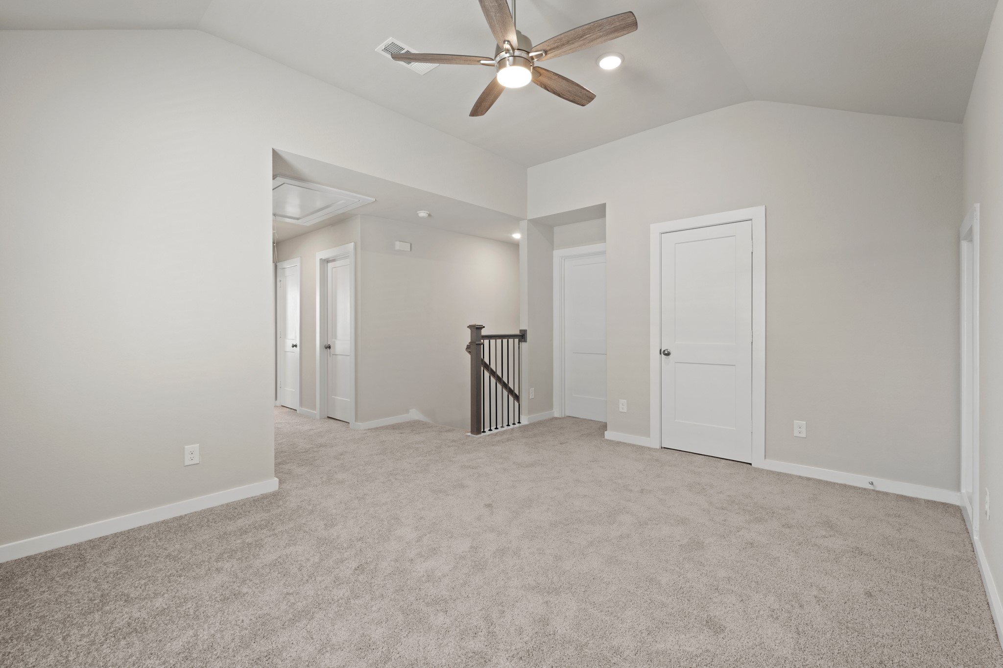 21667 Wave Holw Drive Cypress, TX 77433 - Photo 16 of 27 an empty room with closet and a ceiling fan