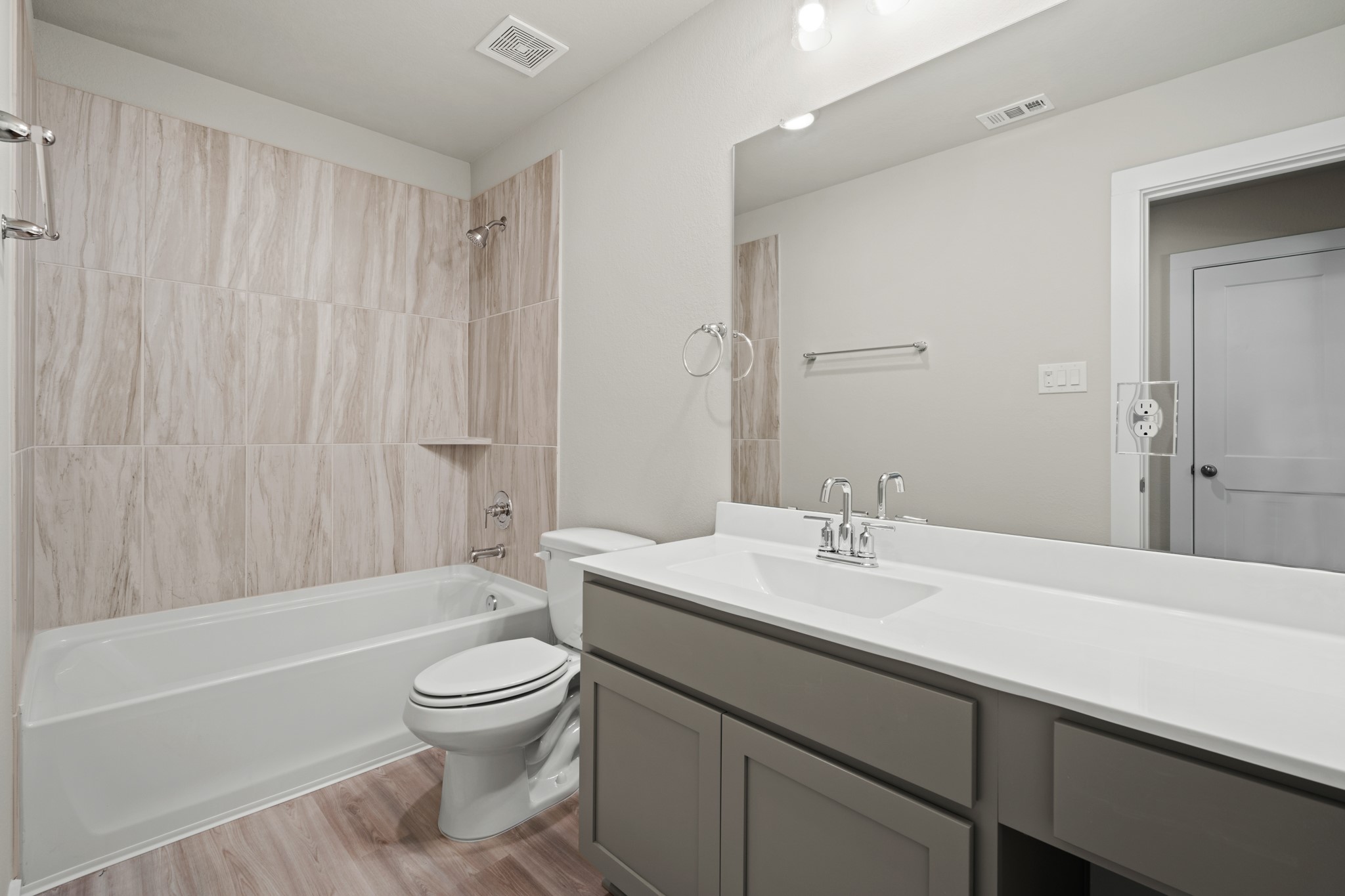 21667 Wave Holw Drive Cypress, TX 77433 - Photo 19 of 27 a bathroom with a sink a toilet and a bathtub