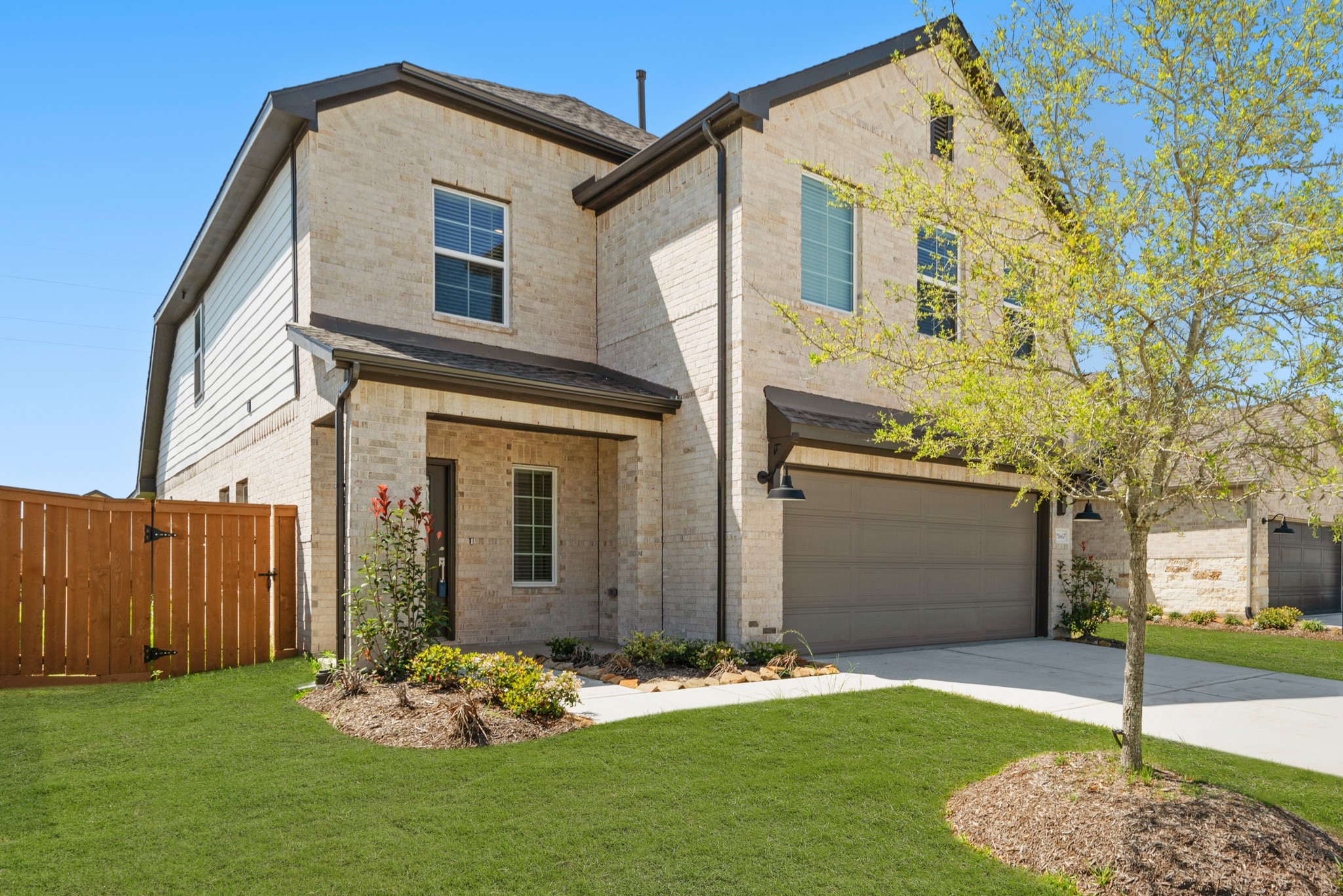 21667 Wave Holw Drive Cypress, TX 77433 - Photo 2 of 27 a front view of a house with a yard