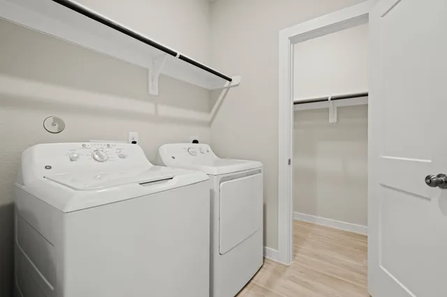 a utility room with dryer and washer