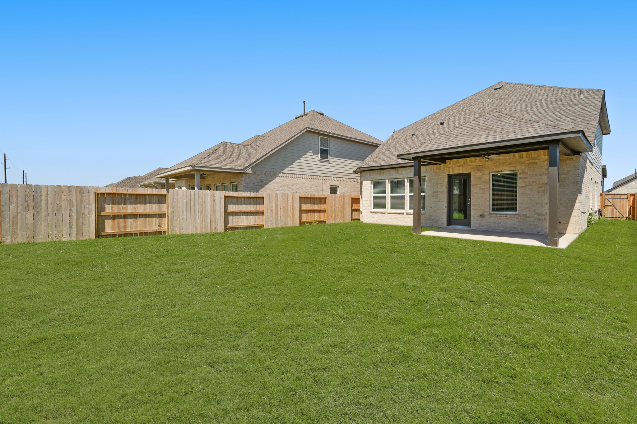 21667 Wave Holw Drive Cypress, TX 77433 - Photo 25 of 27 a view of a house with a yard