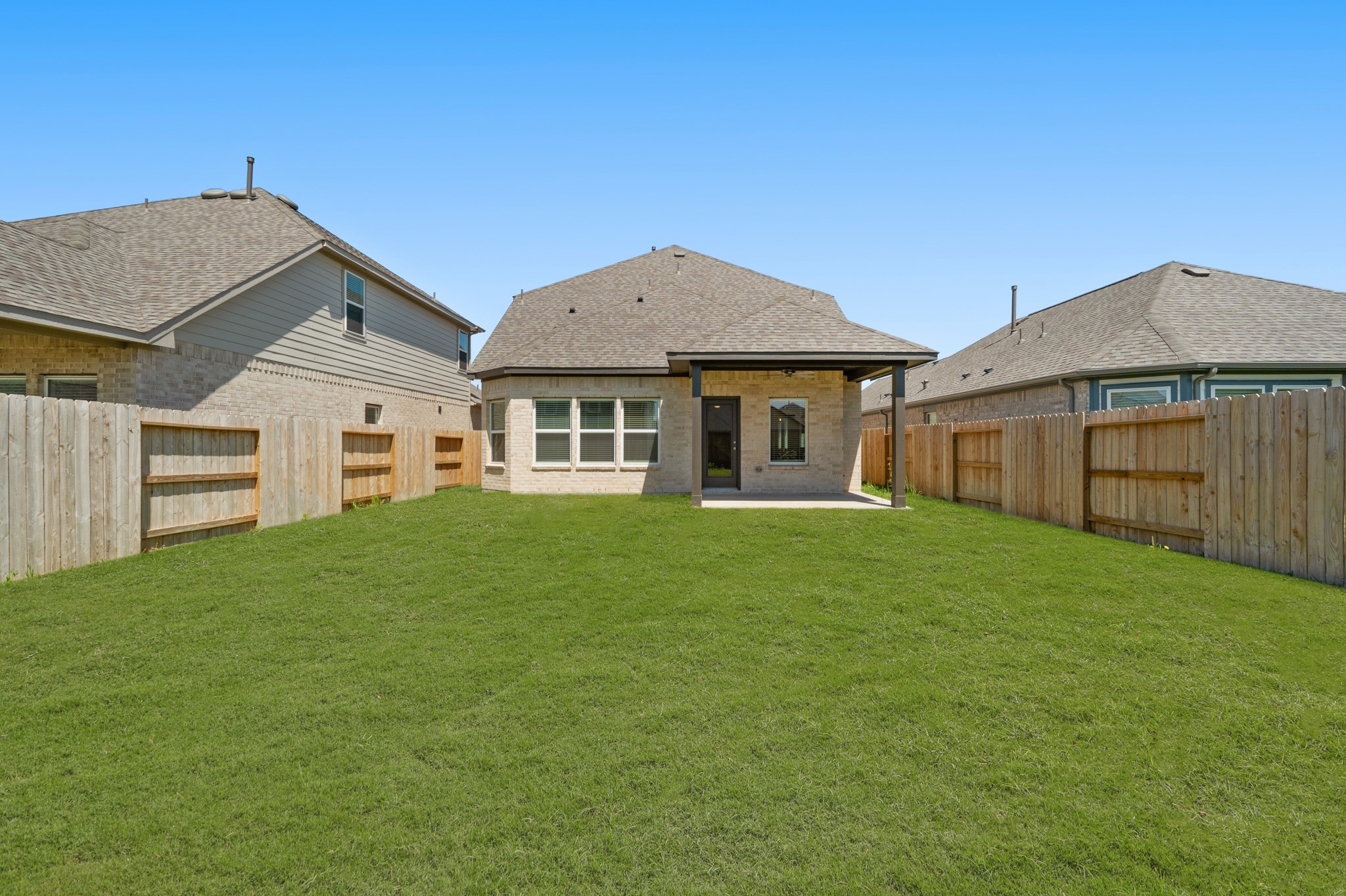 21667 Wave Holw Drive Cypress, TX 77433 - Photo 26 of 27 a front view of a house with a garden