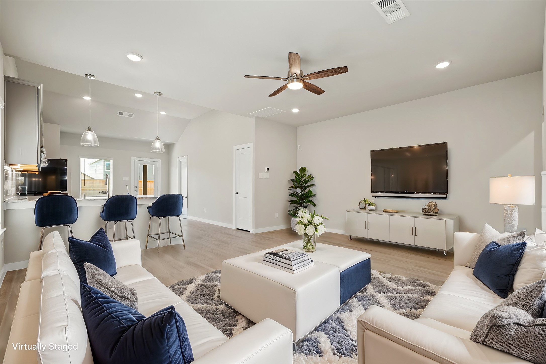 21667 Wave Holw Drive Cypress, TX 77433 - Photo 7 of 27 a living room with furniture and a flat screen tv