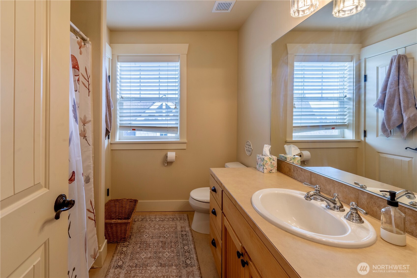 71 Craftsman Court Sequim, WA 98382 - Photo 25 of 33 a bathroom with a sink and a mirror