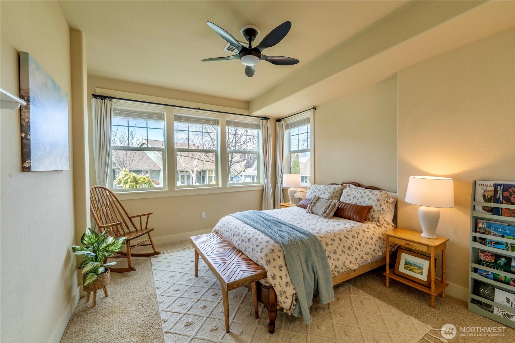 71 Craftsman Court Sequim, WA 98382 - Photo 30 of 33 a bedroom with a bed table and a chandelier