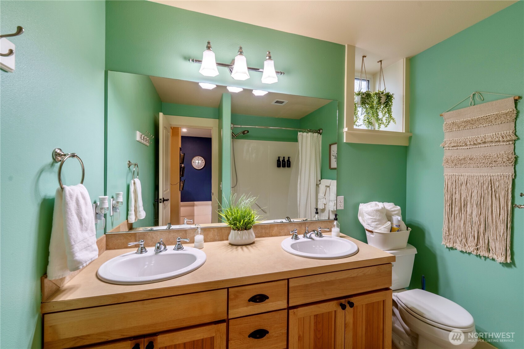 71 Craftsman Court Sequim, WA 98382 - Photo 31 of 33 a bathroom with a sink vanity and a mirror