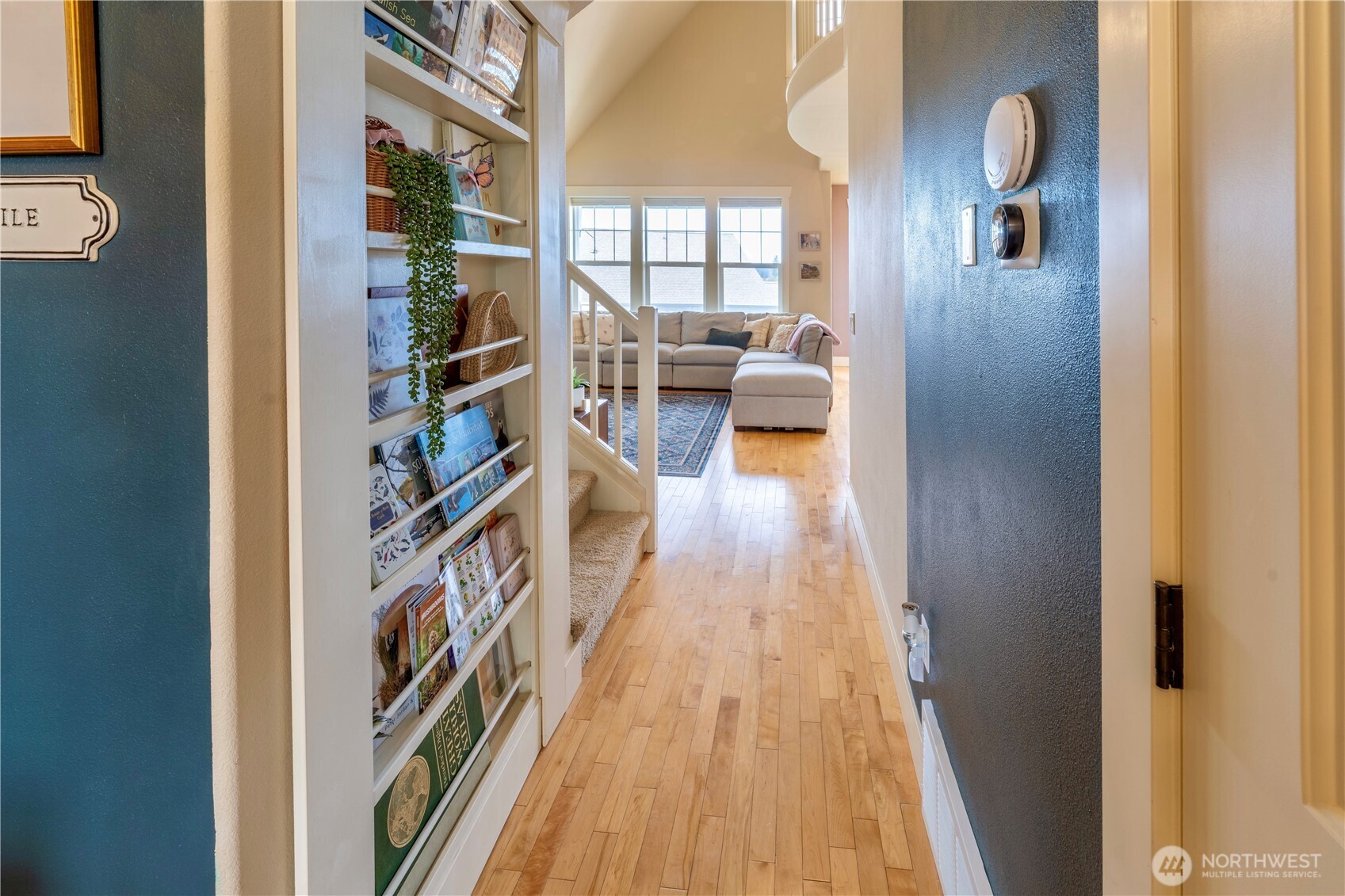 71 Craftsman Court Sequim, WA 98382 - Photo 4 of 33 a view of a hallway with wooden floor and furniture