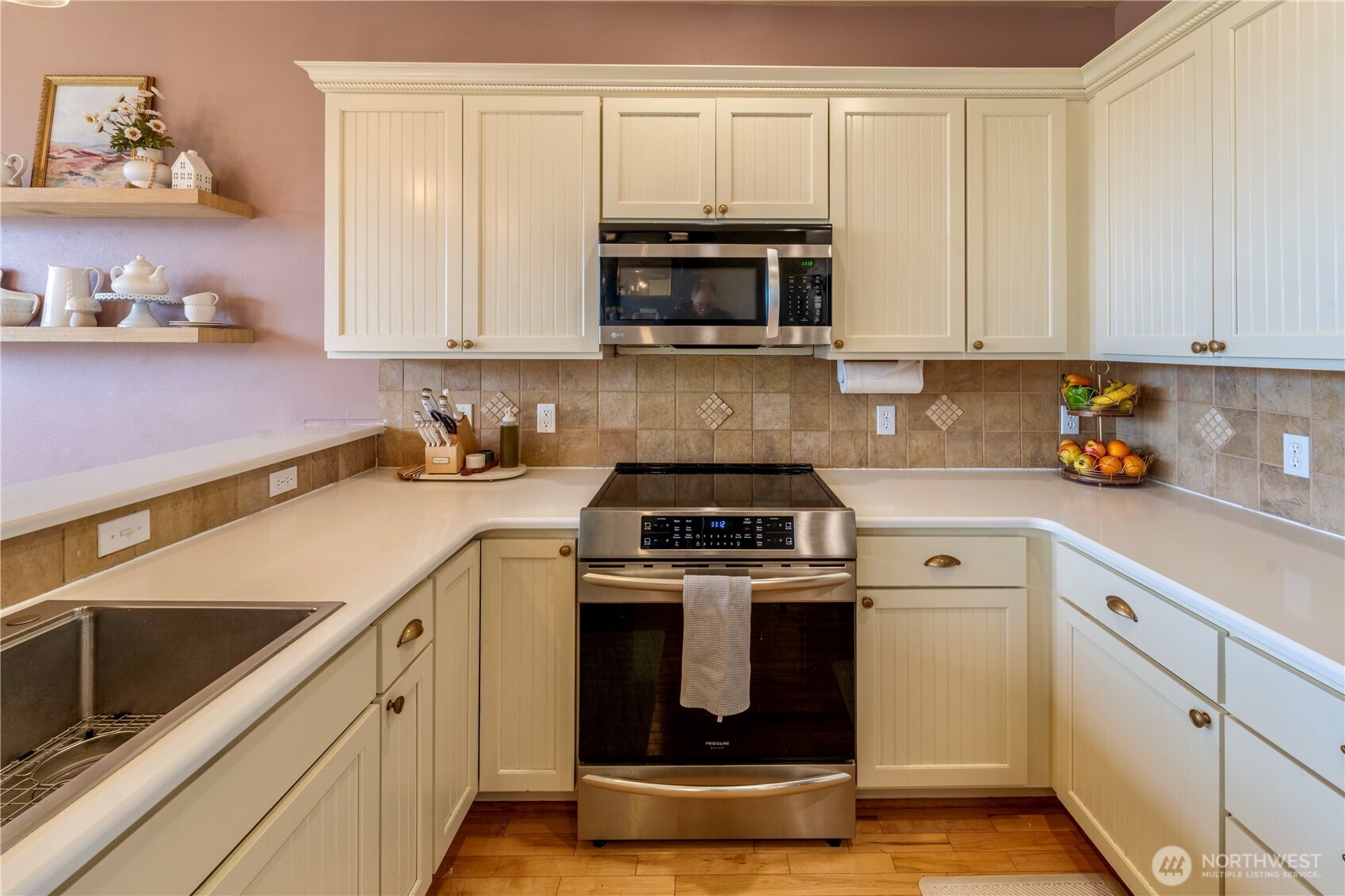 71 Craftsman Court Sequim, WA 98382 - Photo 10 of 33 a kitchen with stainless steel appliances granite countertop grey cabinets a stove a sink and a microwave