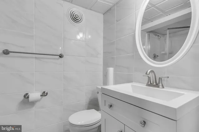 a bathroom with a shower and a toilet