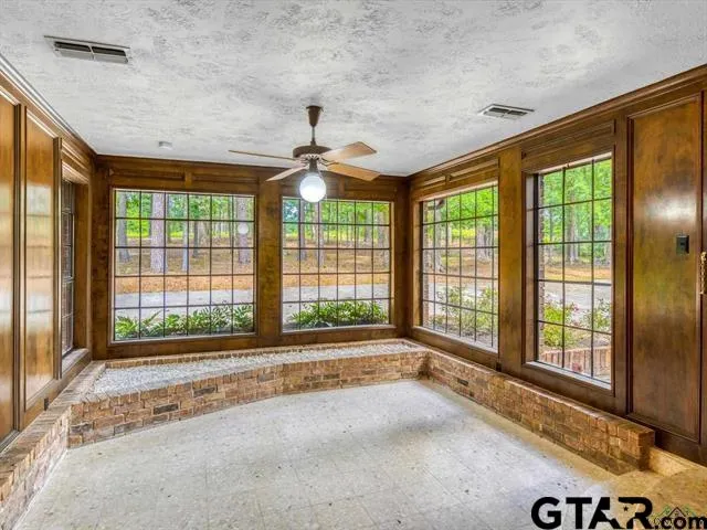 a view of an empty room with a balcony